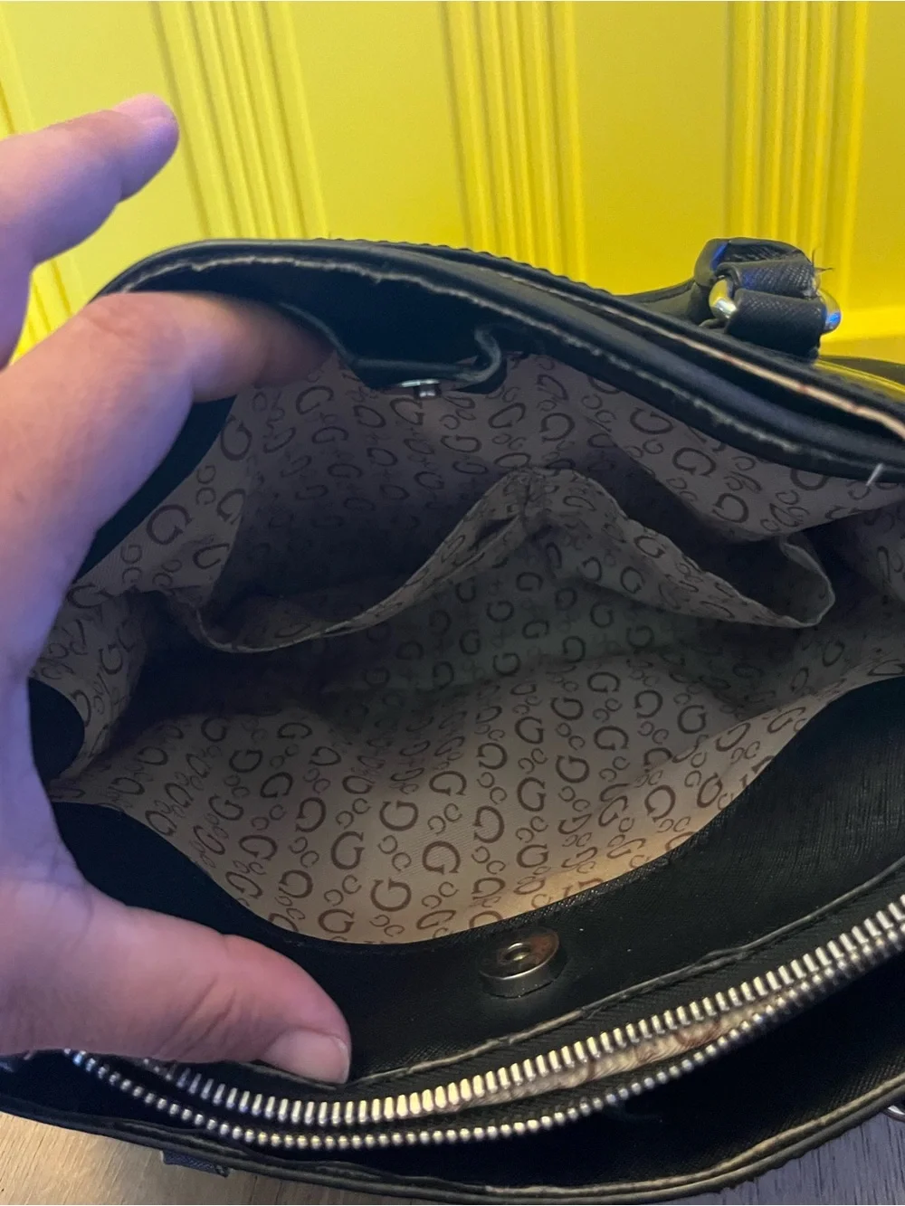 Guess Black Embossed Satchel Bag in good condition except missing one button